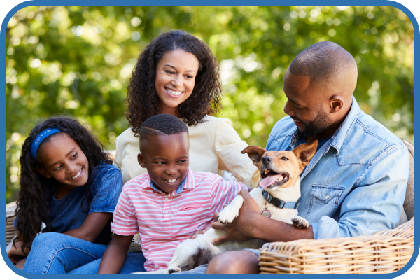 Family outside with pet dog