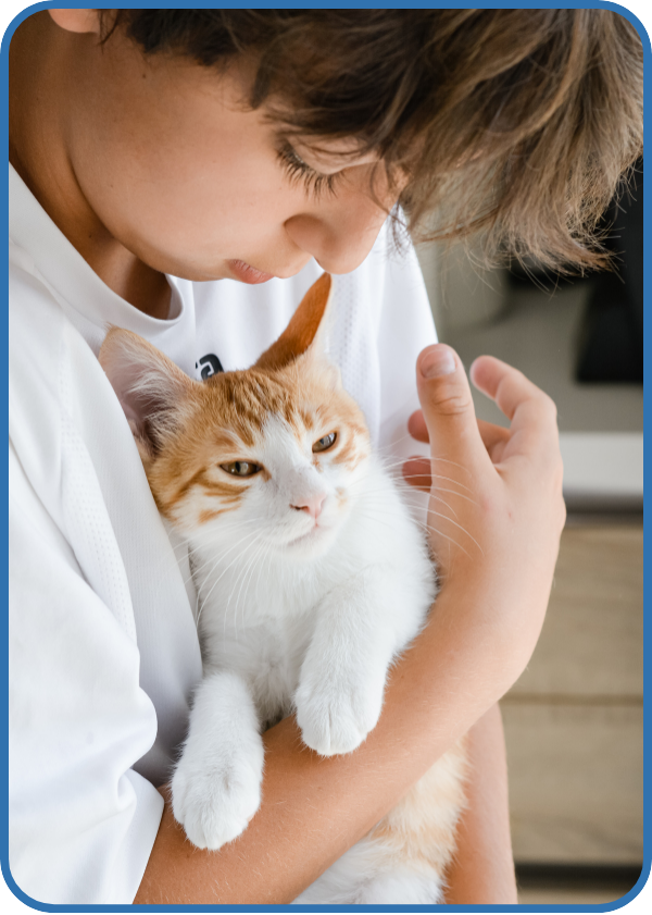 Child with pet cat